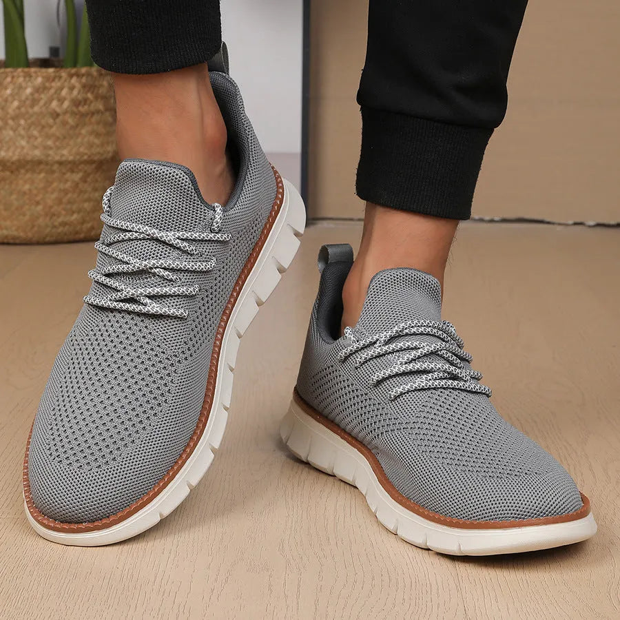 Men's casual sneaker with mesh upper in black or grey colour with round toe design
