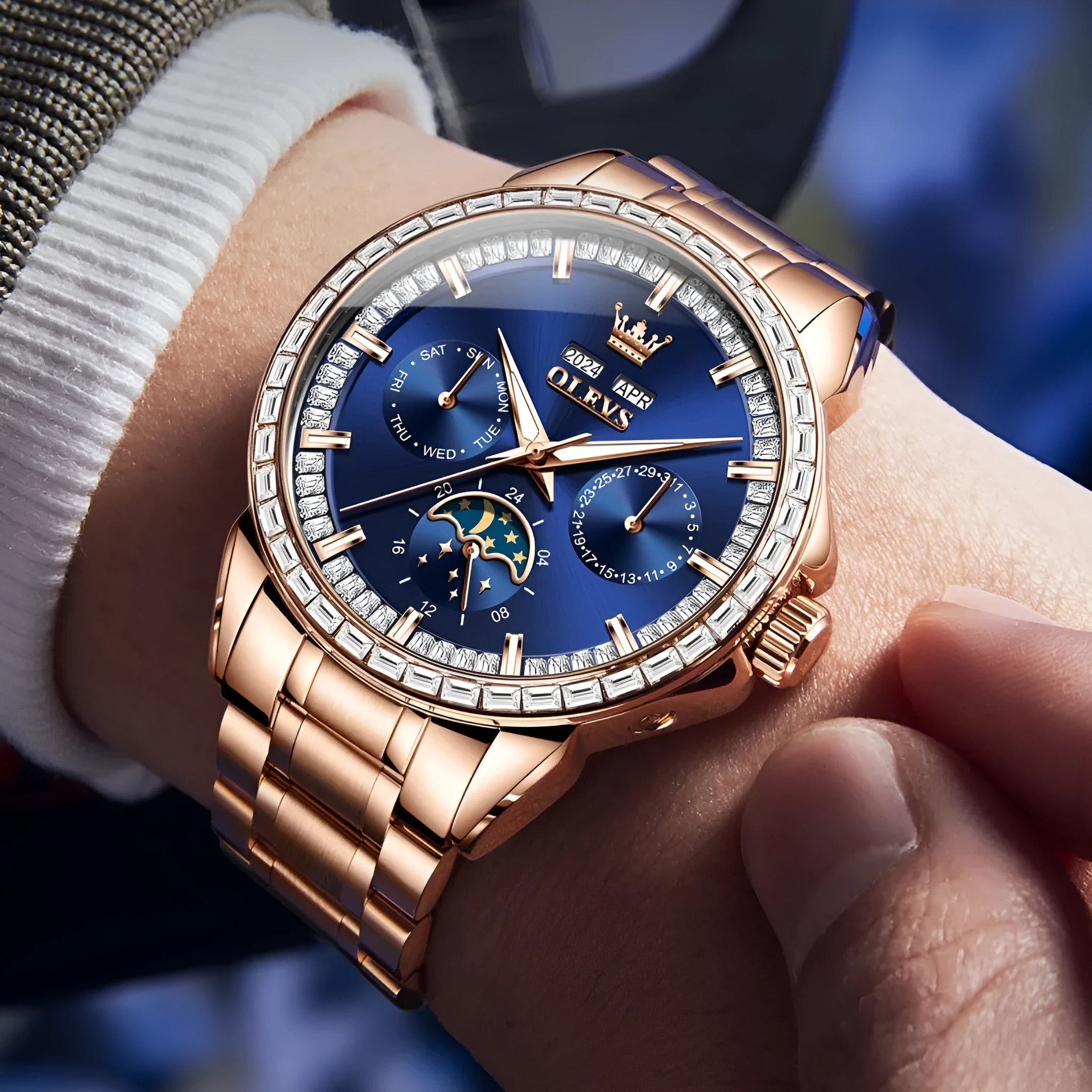 Men's stainless steel automatic watch with diamond dial on wrist, showing butterfly clasp.