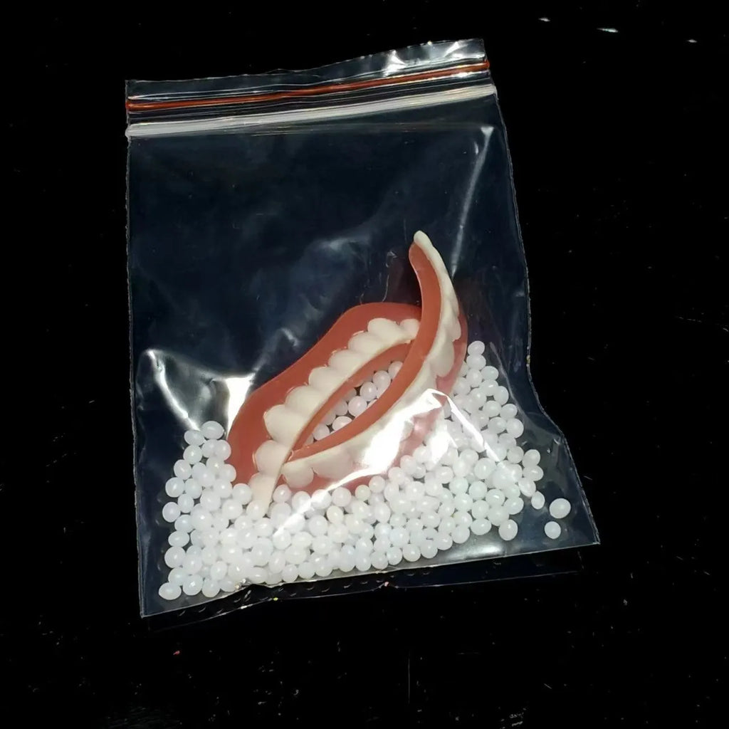 Silicone simulation dental dentures showing upper and lower teeth in training configuration