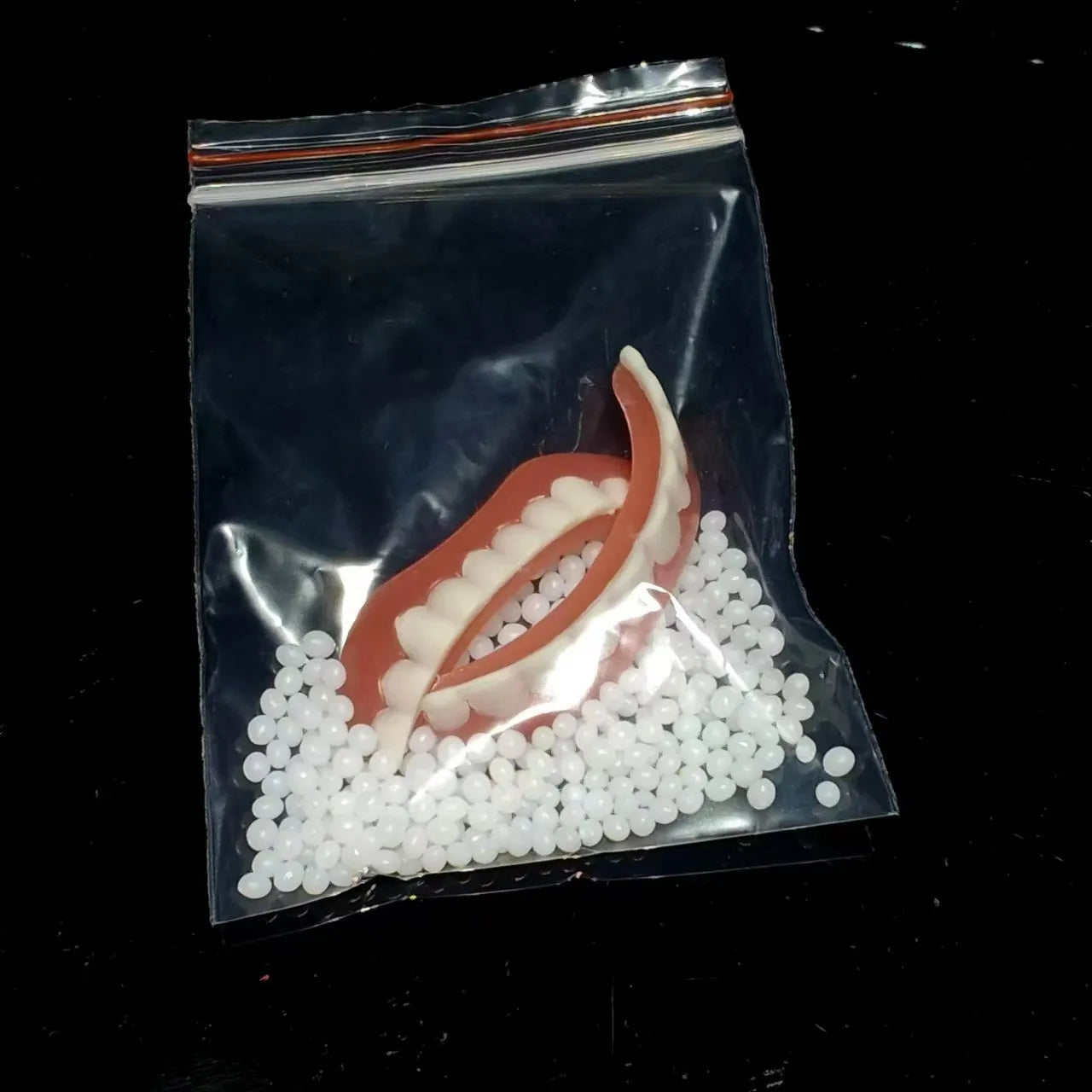 Silicone simulation dental dentures showing upper and lower teeth in training configuration