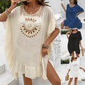 Apricot crochet stitch tassel dress on a hanger, showing patchwork skirt detail.