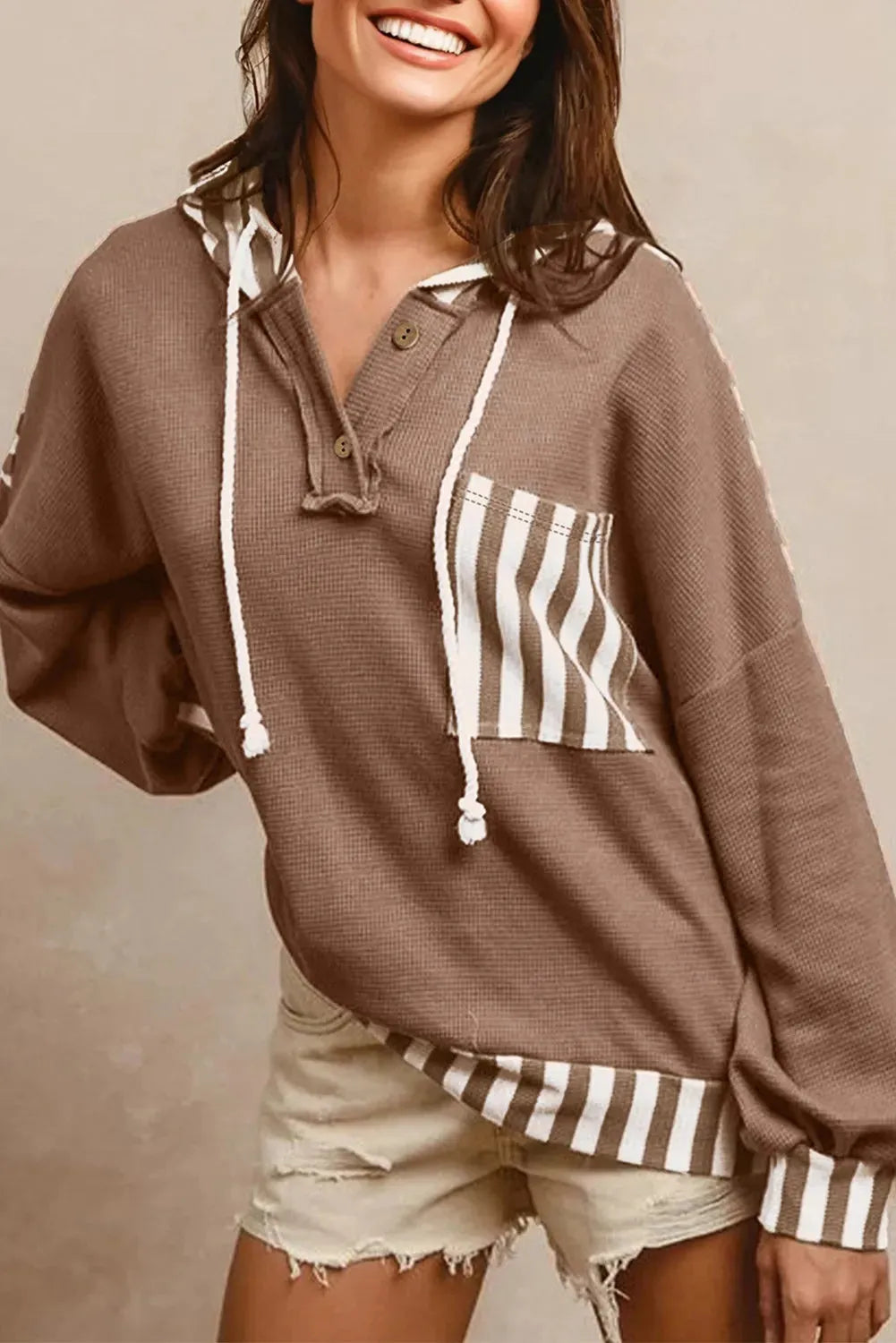 Straw yellow waffle texture striped patchwork hoodie with button neck and drawstring.