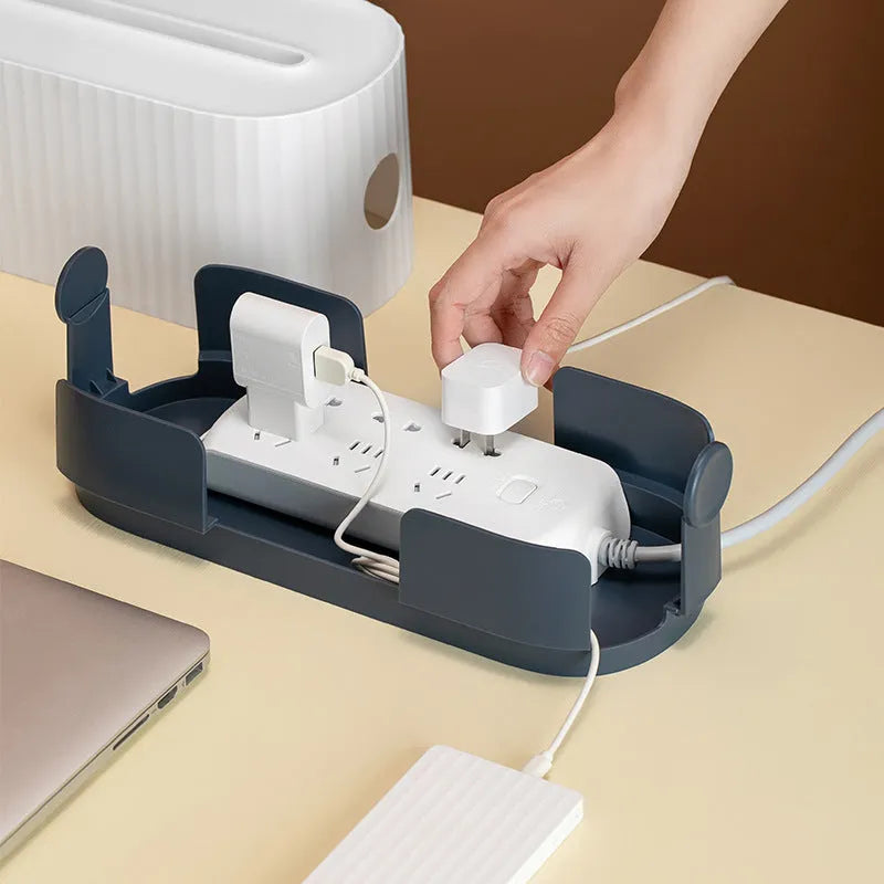 Blue and white HIPS plastic power strip storage box with lid open, showing cable holes and interior space.