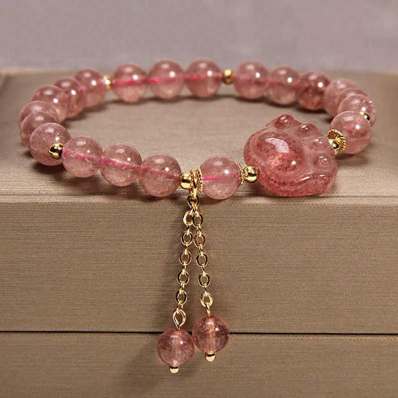Women's multi-layer crystal bracelet with natural garnet, strawberry quartz pendants, and jinsi jade beads in assorted colours.