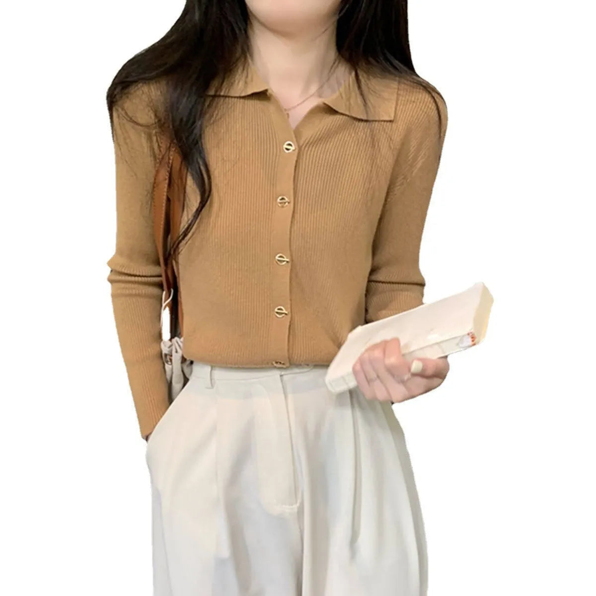 Long-sleeved loose-fitting viscose cardigan top in beige, shown worn open over a top