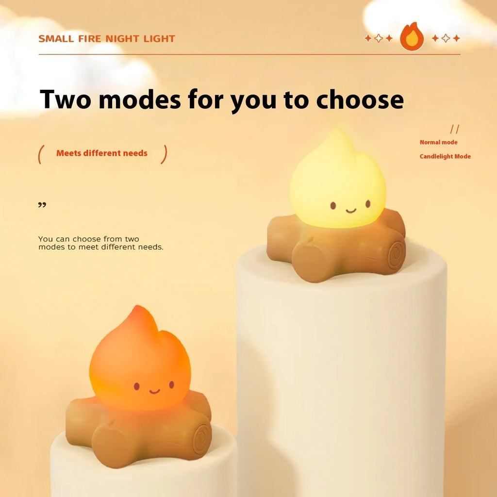 Small yellow silicone cartoon fire pile night lamp with ABS plastic shade on a table