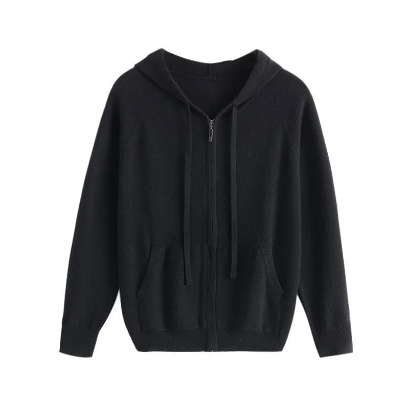 Man wearing a haze blue hooded zip-front cashmere knit cardigan in a casual setting.