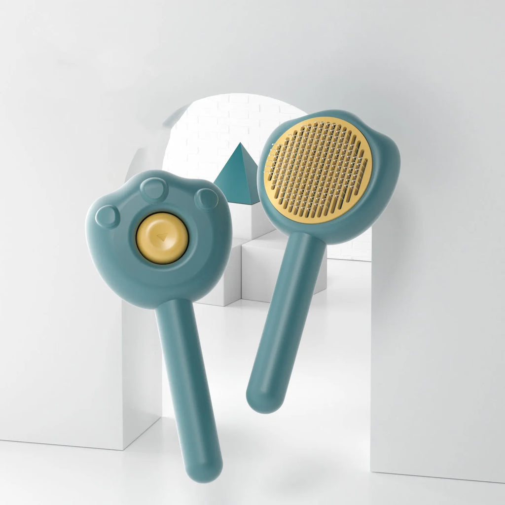 Self-cleaning pet grooming comb with blue handle for cat hair removal