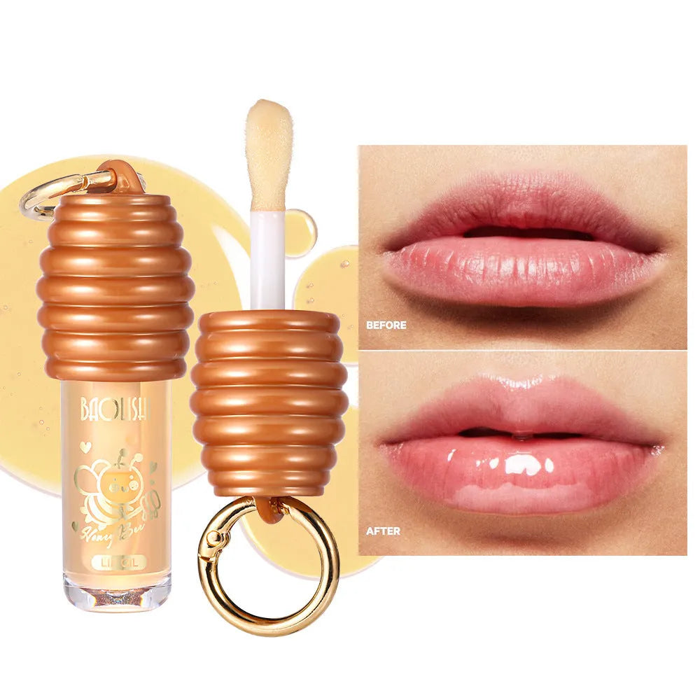 Honey lip gloss keychain with portable pannier bag carrier showing moisturising lip product