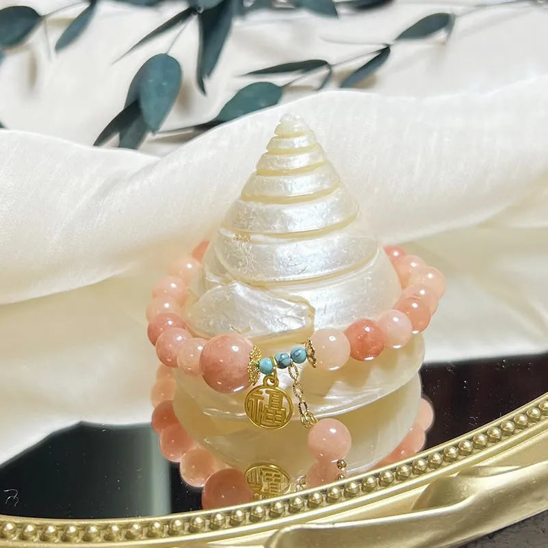 Pink natural stone set on a simple alloy chain bracelet for women.