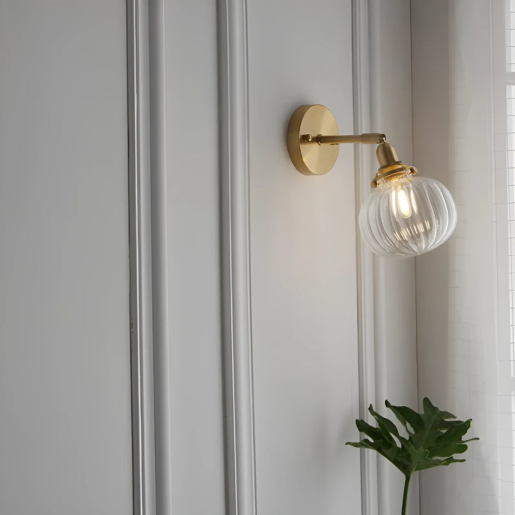 Pumpkin-shaped glass wall lamp in blue and transparent colour options.