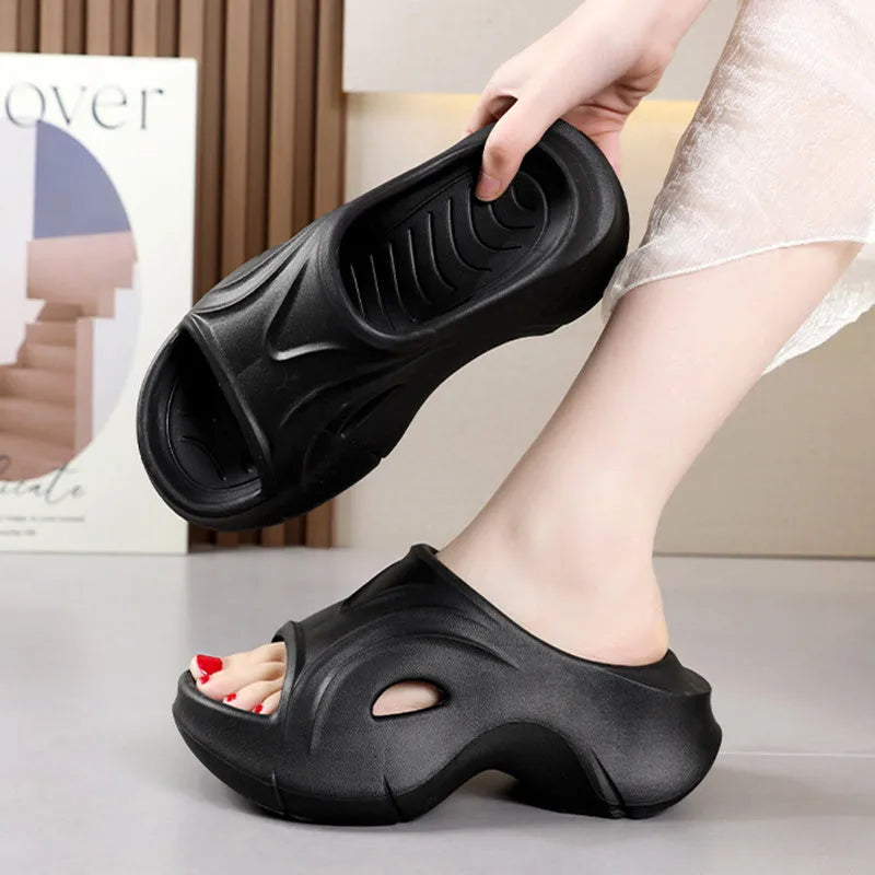 Women's white thick-soled EVA slippers with round toe for beach wear.