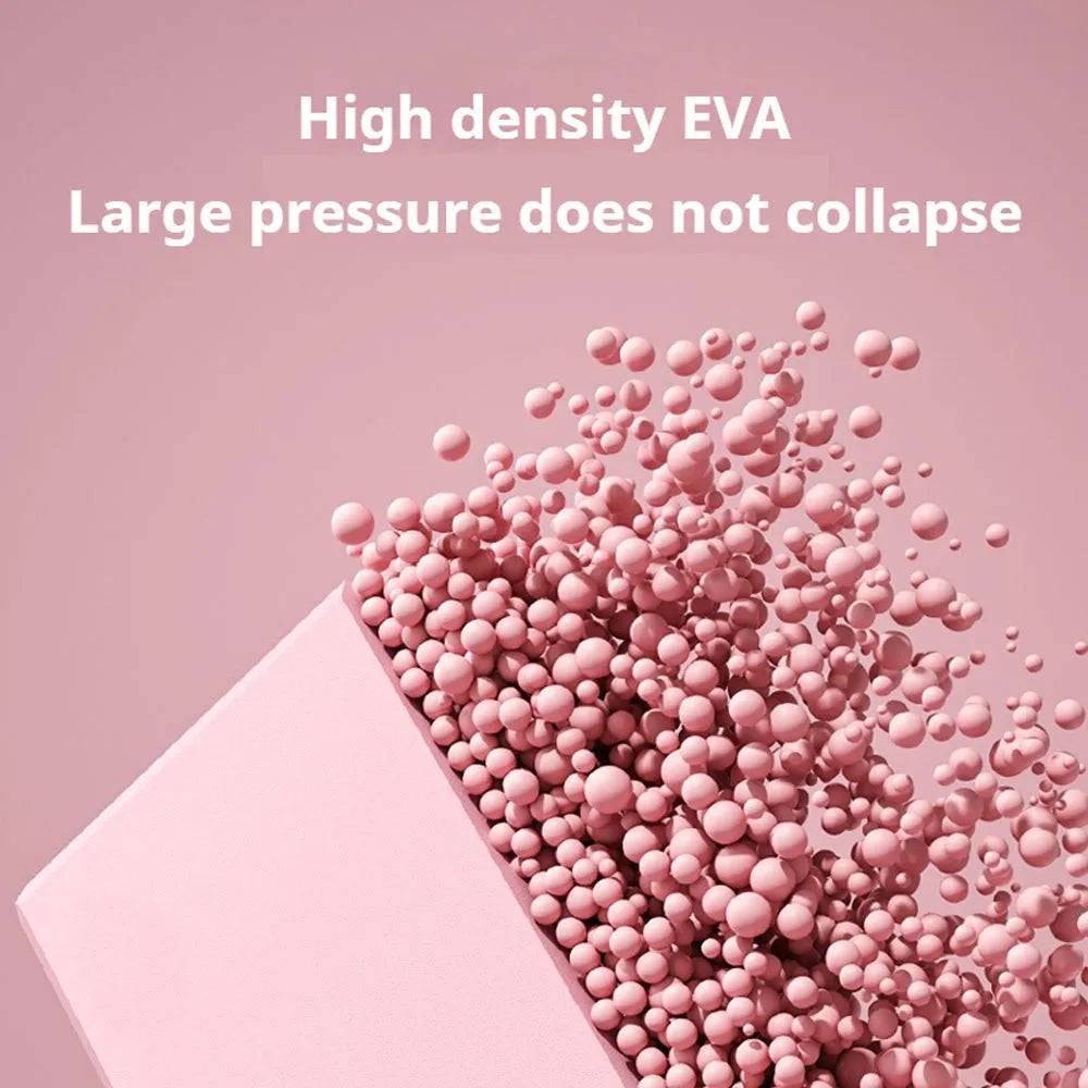 Solid colour EVA foam yoga block measuring 23cm long on a workout mat.