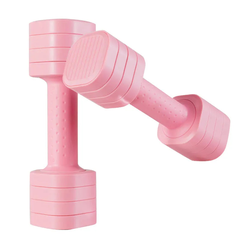 Set of pink ABS plastic dumbbells with slim-fit handles on a home gym mat.