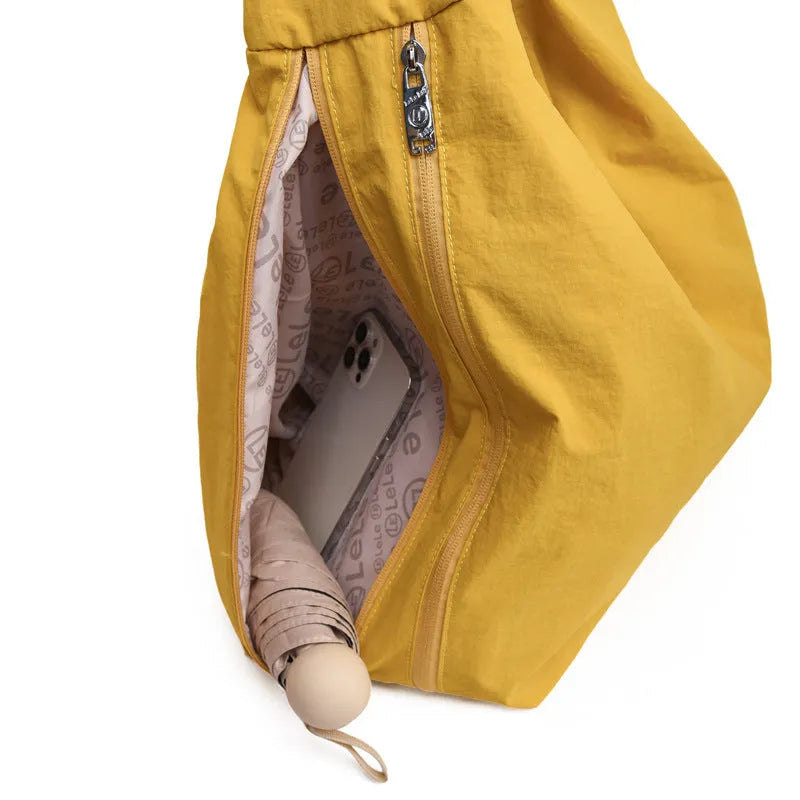 Women's heart-shaped nylon underarm bag in black, blue, khaki, and yellow colour options