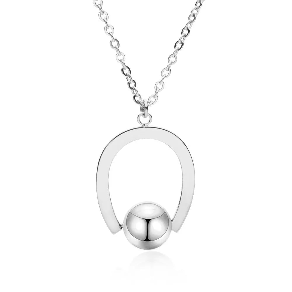 Gold-coloured adjustable stainless steel necklace with a geometry pendant on a cross chain.