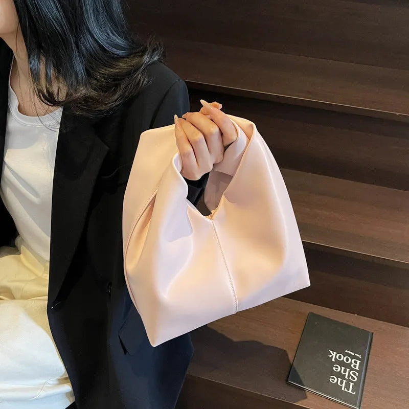 Women's casual PU leather dumpling-shaped handbag in multiple colours with internal organiser pockets.