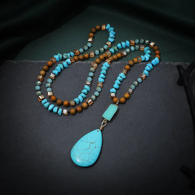Blue turquoise gem inlaid drop pendant on a long ball bead necklace chain