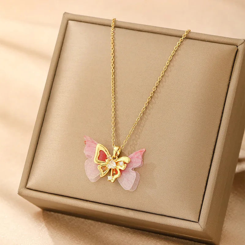 Women's copper necklace showing four pendant options: heart, round diamond, butterfly and cross designs