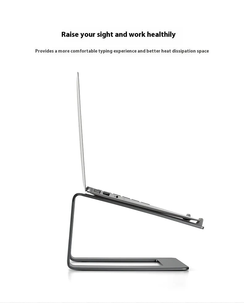 Black aluminium laptop stand with angled platform on a wooden desk