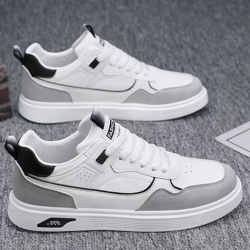 Men's low-top canvas board shoes in black, beige, or grey with round toe and leather stitching.