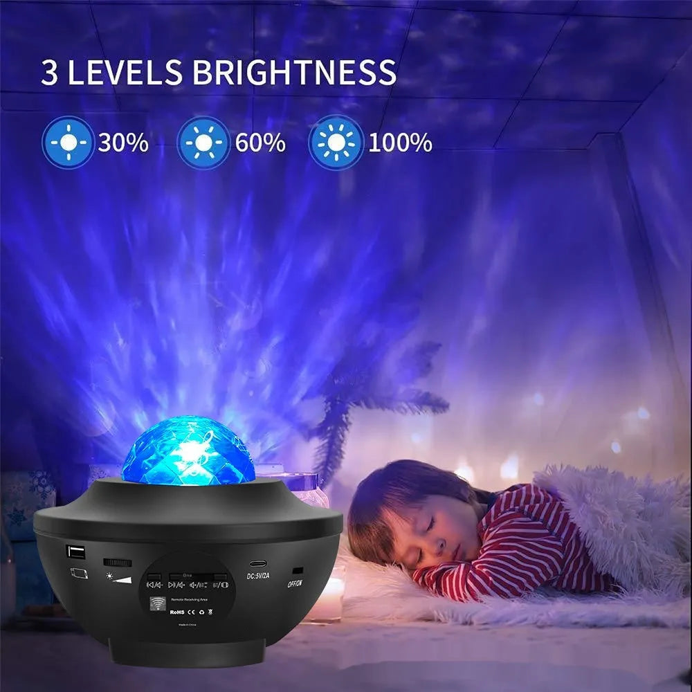 Black star projector lamp on desktop showing rotating laser water ripple and star projection effects