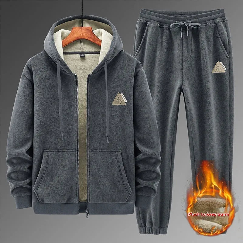 Grey cashmere hooded sweater and matching pants casual sports suit laid flat.