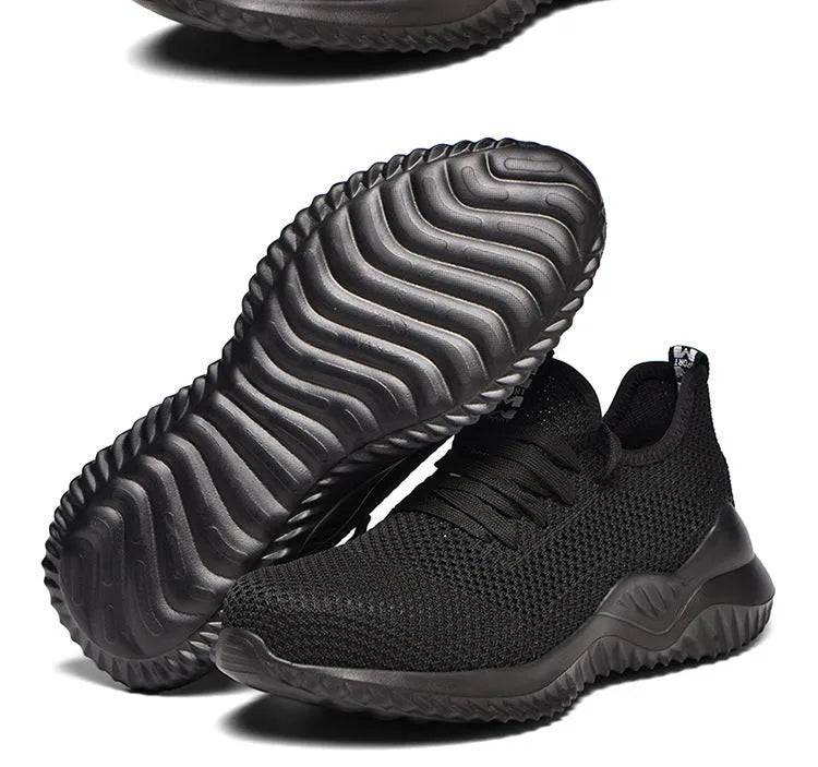 Men's black safety work shoes with steel toe cap and EVA sole on a grey background.