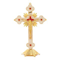 Gold geometric zinc alloy car ornament with micro-inlaid design on a desktop.
