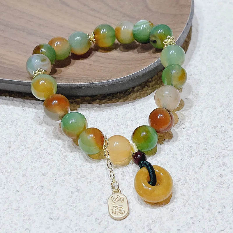 Yellow peacock agate women's bracelet with peace buckle clasp and old mine topaz accents
