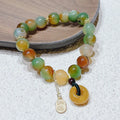 Yellow peacock agate women's bracelet with peace buckle clasp and old mine topaz accents
