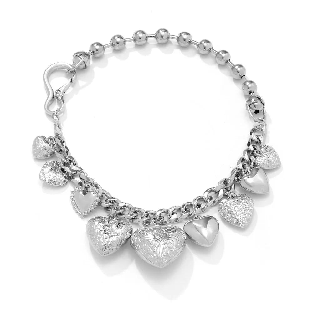 Exaggerated carved heart pendant necklace on metal chain with adjustable 41-50cm length in gold finish