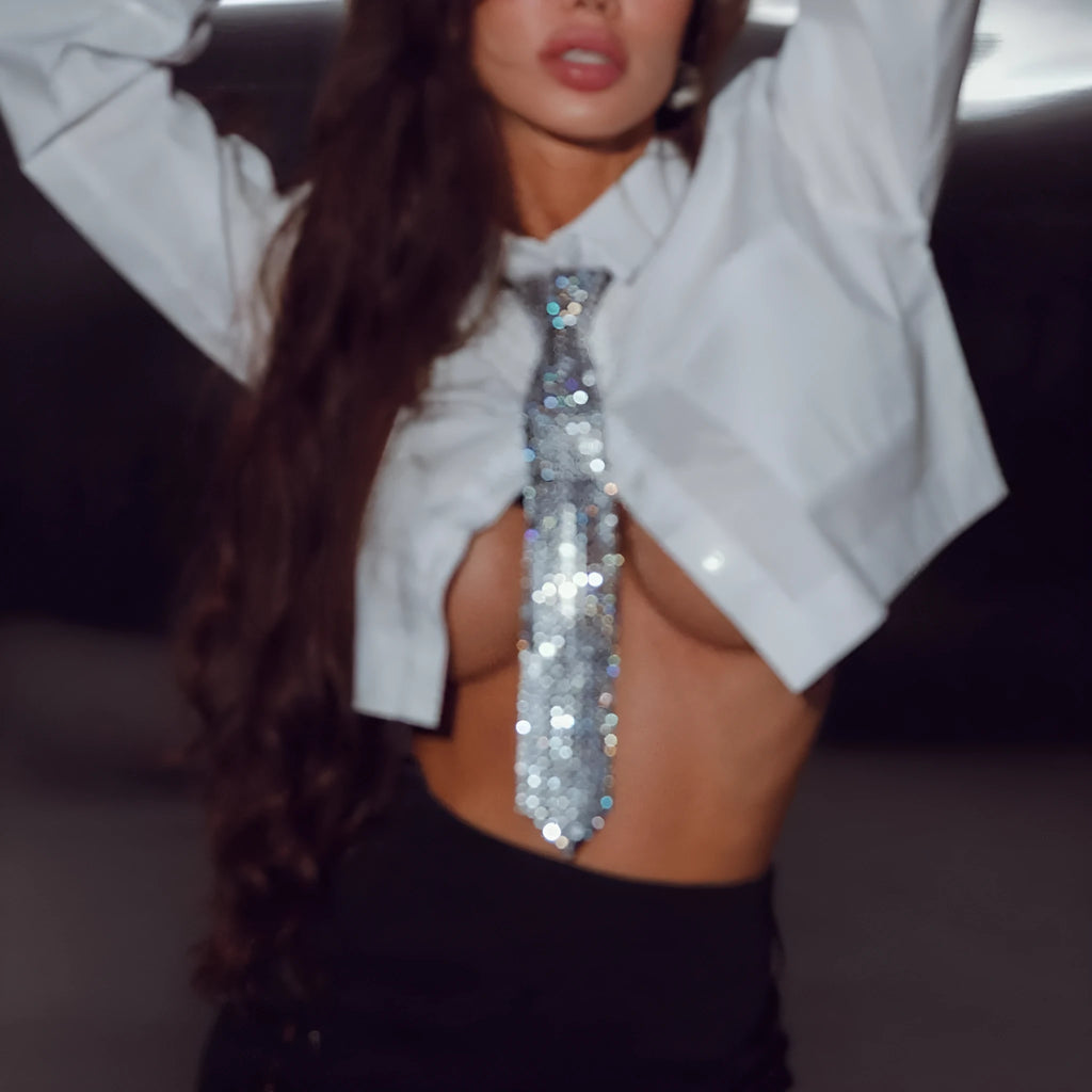 Arrow-shaped metal sequin bow tie with an electroplated finish in silver, black, or gold.