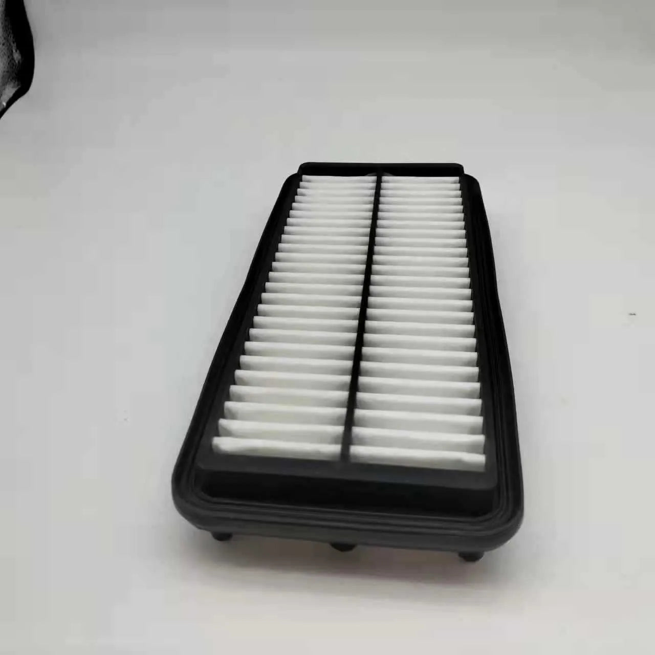 Black panel car air filter with dimensions 256mm by 113mm by 40mm for Modern vehicles.