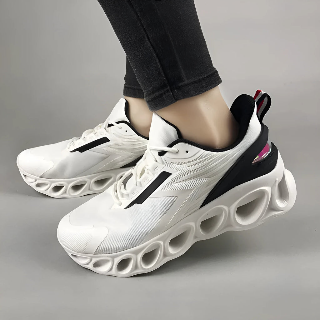 Casual low-top sports shoes in black with mesh upper, round toe, and white EVA sole on a plain background.