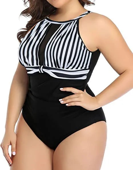 Women's black lace one-piece swimsuit on a hanger, showing front design.