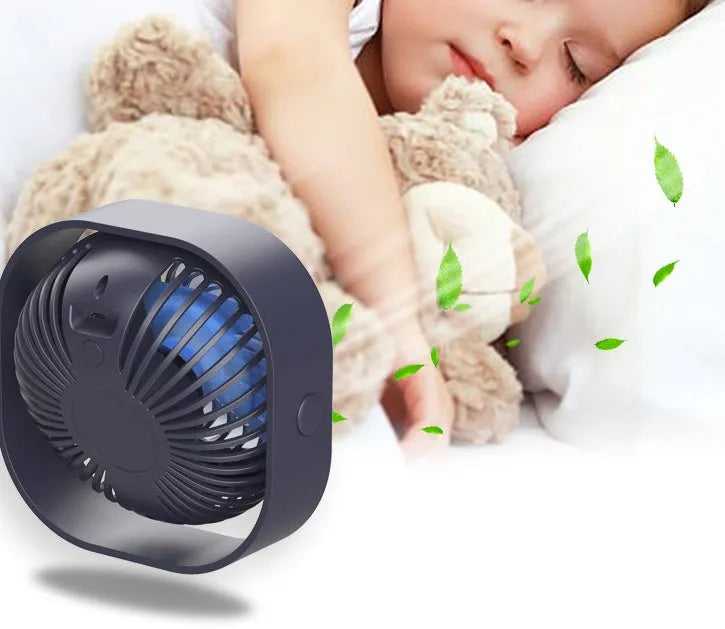 Blue USB desk fan with 360-degree rotation and rotary switch on a desk.
