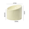 Dark green, light green or yellow ceramic elevated cat bowl with tilted round shape on raised base