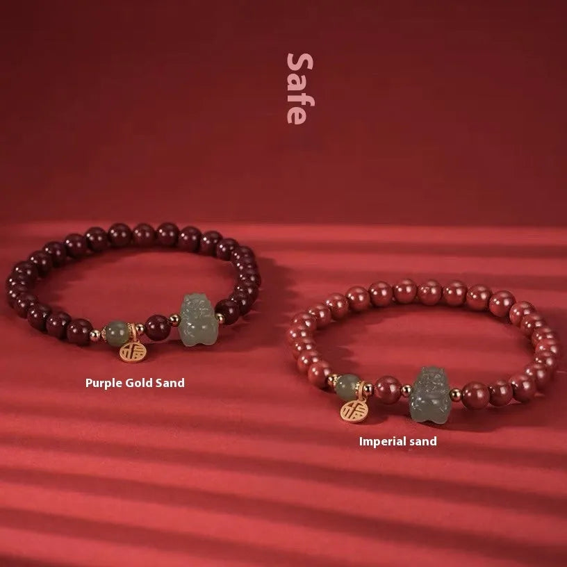 Hetian Jade bracelet with cinnabar accents showing 8mm beads and animal zodiac modelling