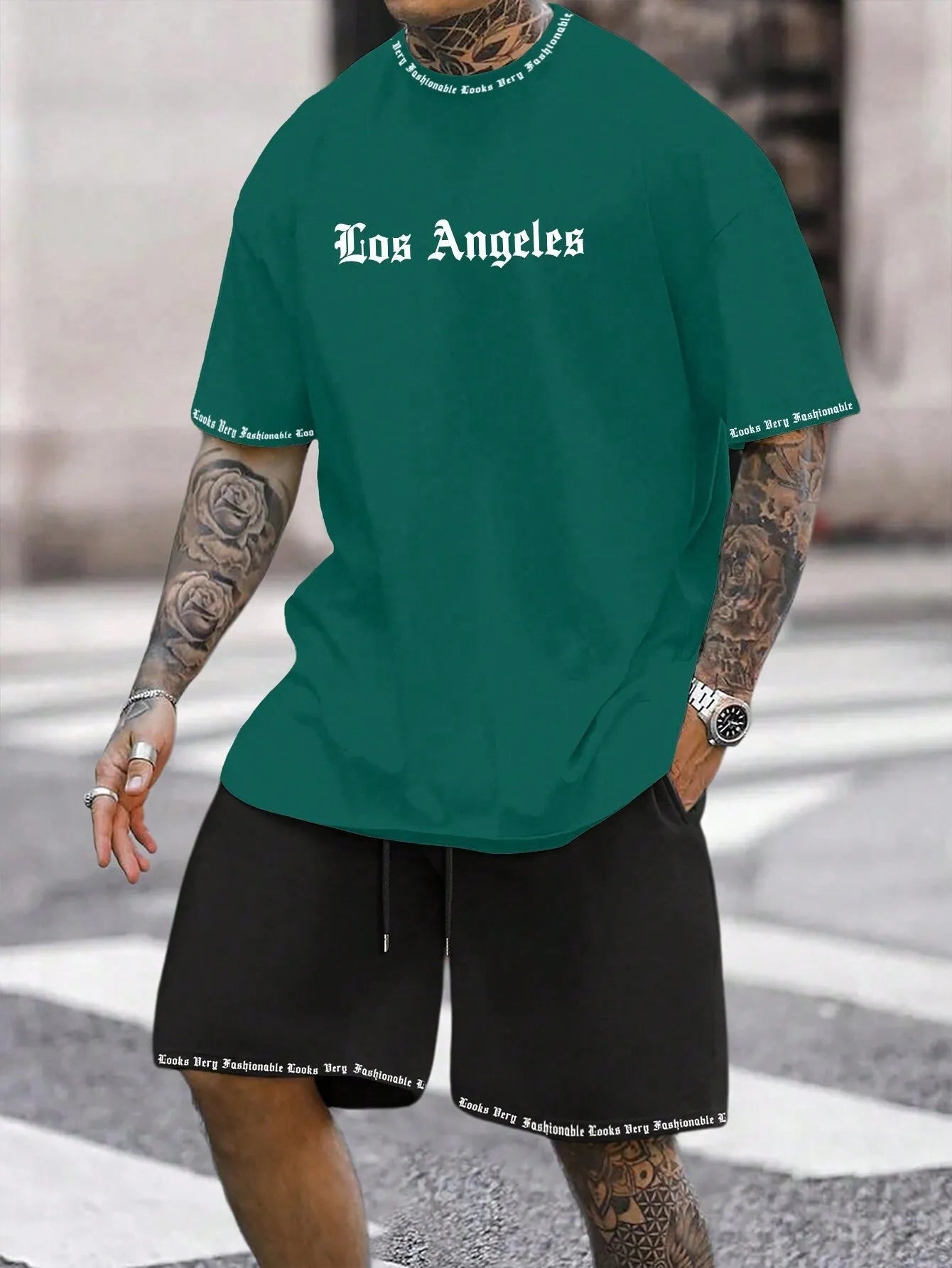 Men's blue printed short sleeve top and matching shorts sports set laid flat