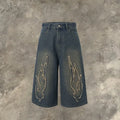 Men's cropped denim shorts with flame embroidery patches in straight cut design for summer street style