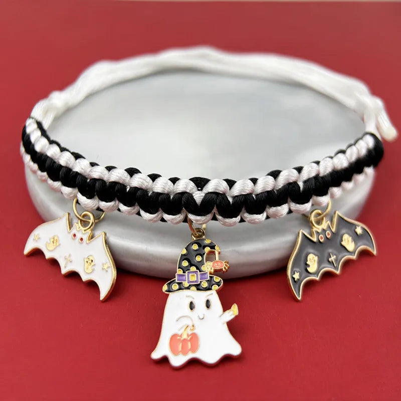 Halloween pet collar with zinc alloy charm showing pumpkin bat design on adjustable black webbing