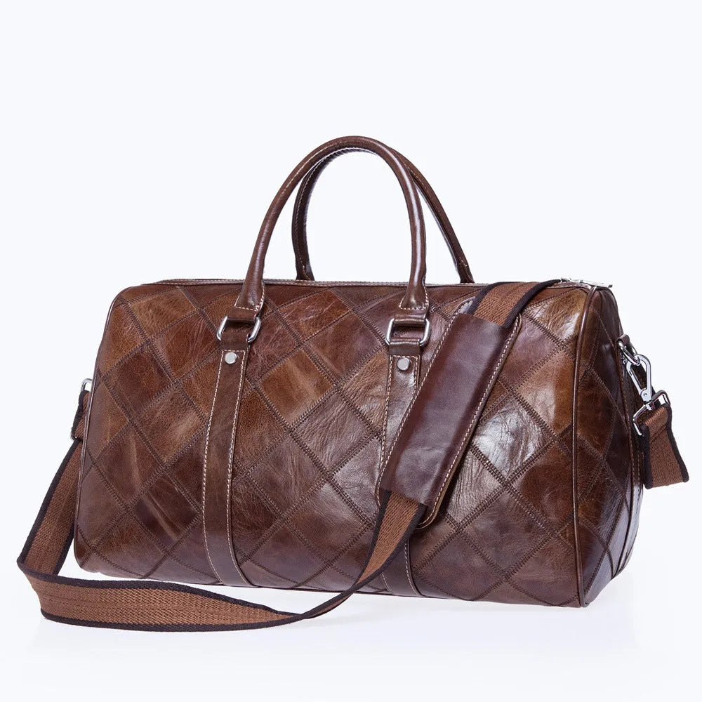 Vintage brown leather men's duffel bag with a single shoulder strap, shown open to reveal internal phone and ID pockets.