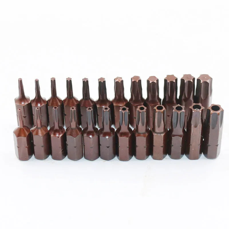 Black steel screwdriver bits T6 to T40 with hollow and solid hex heads on a magnetic strip.