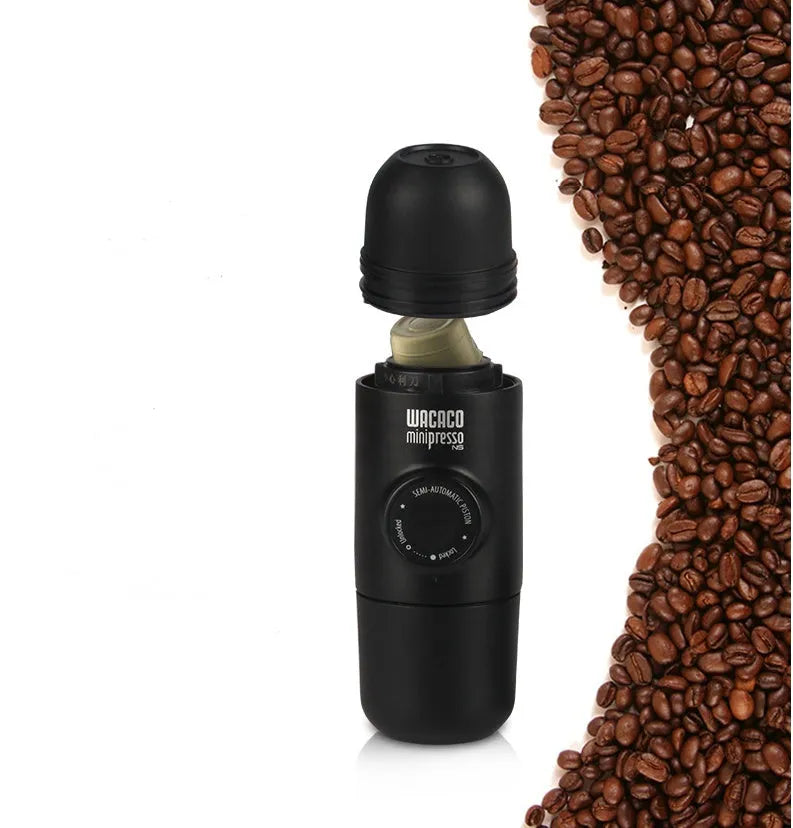 Black portable manual coffee machine showing compact 6cm design with pressure system for travel brewing