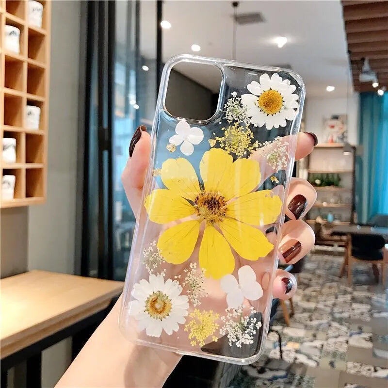 Floral TPU phone case with large flower pattern, available in pink and yellow versions, showing back cover design for iPhones