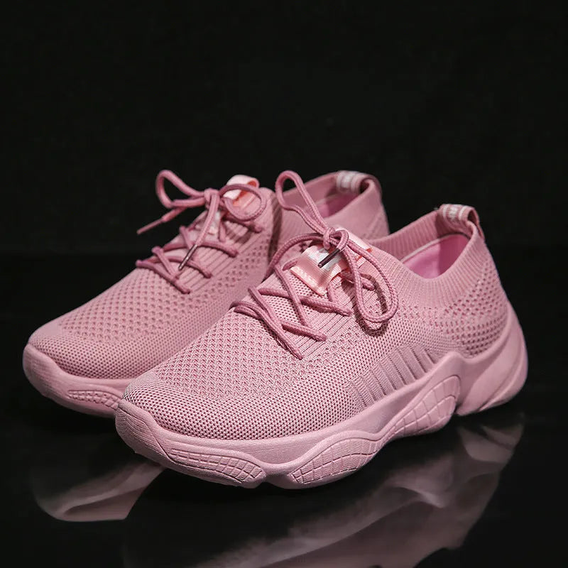 Women's white thick-soled sports shoes with a woven upper and front strap in a candy colour.