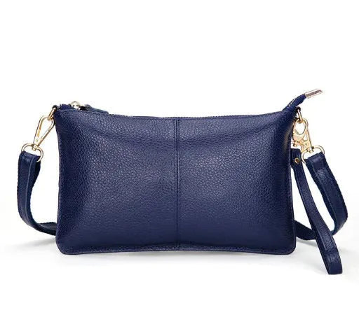 Lady's cowhide slant handbag with a hand strap and long shoulder strap shown in a selected colour.