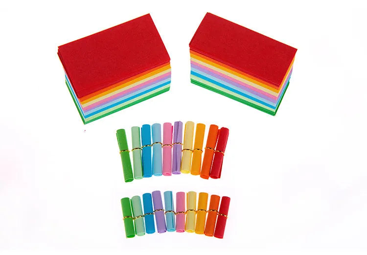 Assorted colourful mini paper scrolls with metal eyelets, shown in 3x7cm, 4x7cm and 5x5cm sizes