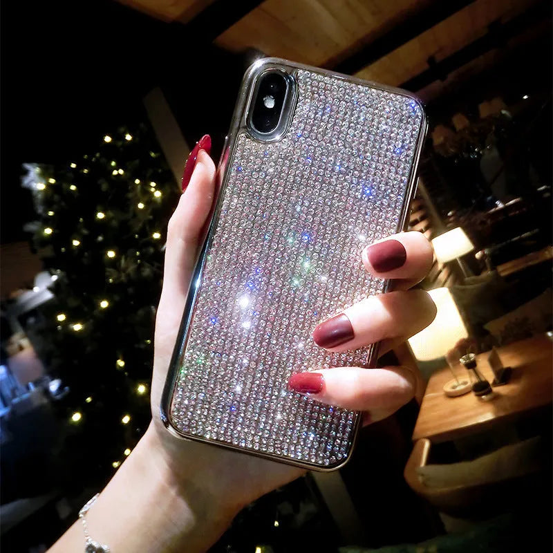 Silver glitter diamond pattern silicone phone case with crystals for iPhone.